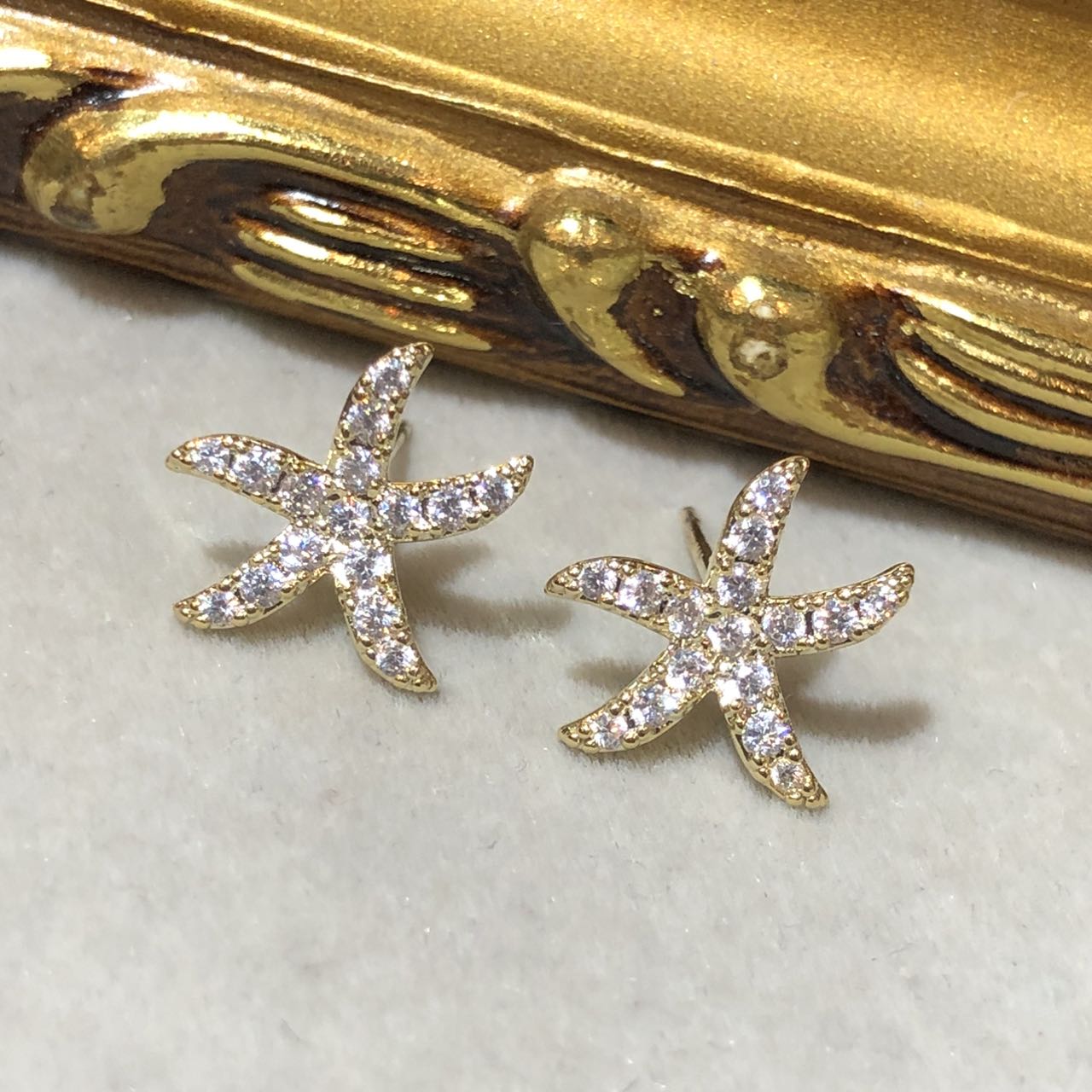 Tiviss Gold Starfish Earrings