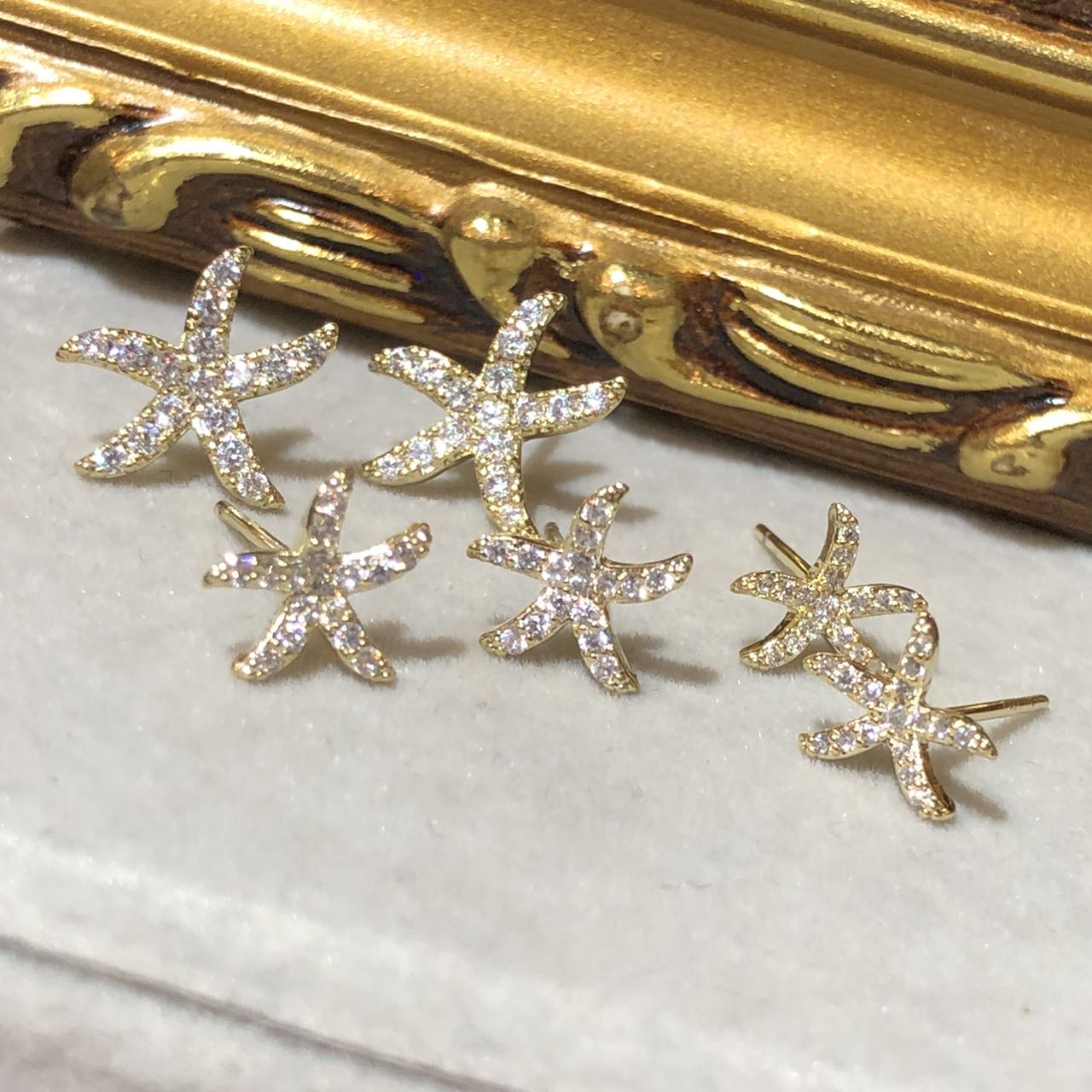 Tiviss Gold Starfish Earrings